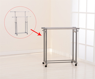 The floor-standing double-bar drying rack is cleverly retracted